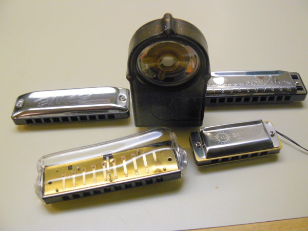 Smokey Amp compared with some harmonicas for size