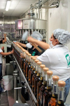 hammering corks into bottles at El Agave