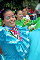 Mexican girls dance in traditional costume