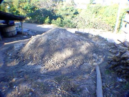 Covered palenque (horno) cooking agaves